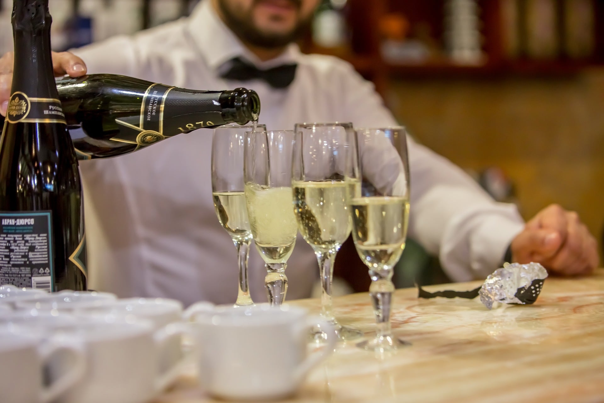 Working as a part time bar-tender at a local restaurant can help you earn some extra bucks for your travels.