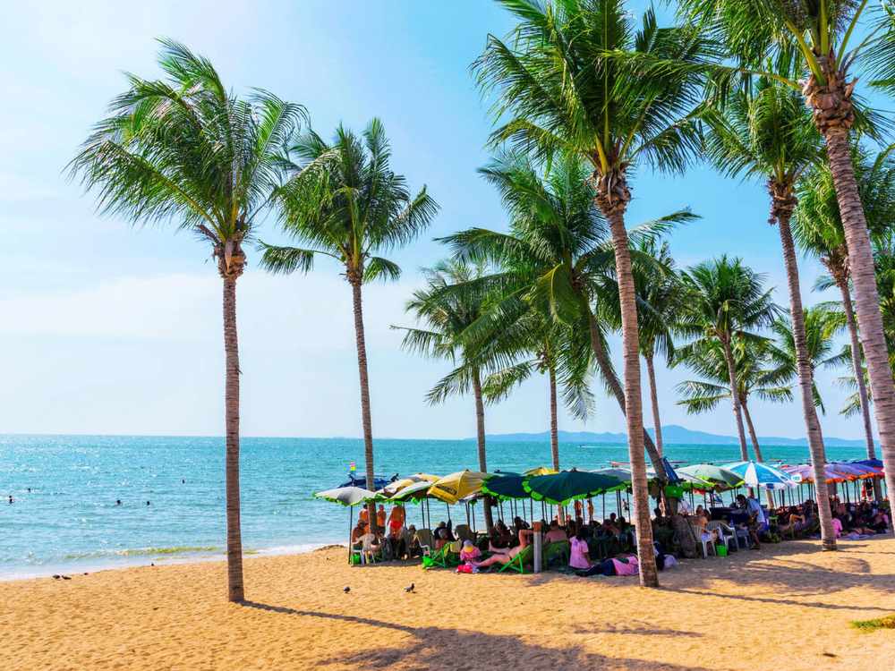 This is a view of Jomtien beach a popular tourist beach in Pattaya.