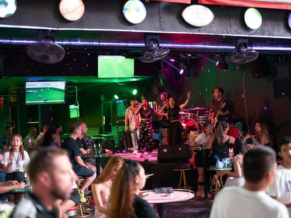 Crowded Phuket nightlife scene on a vibrant evening.