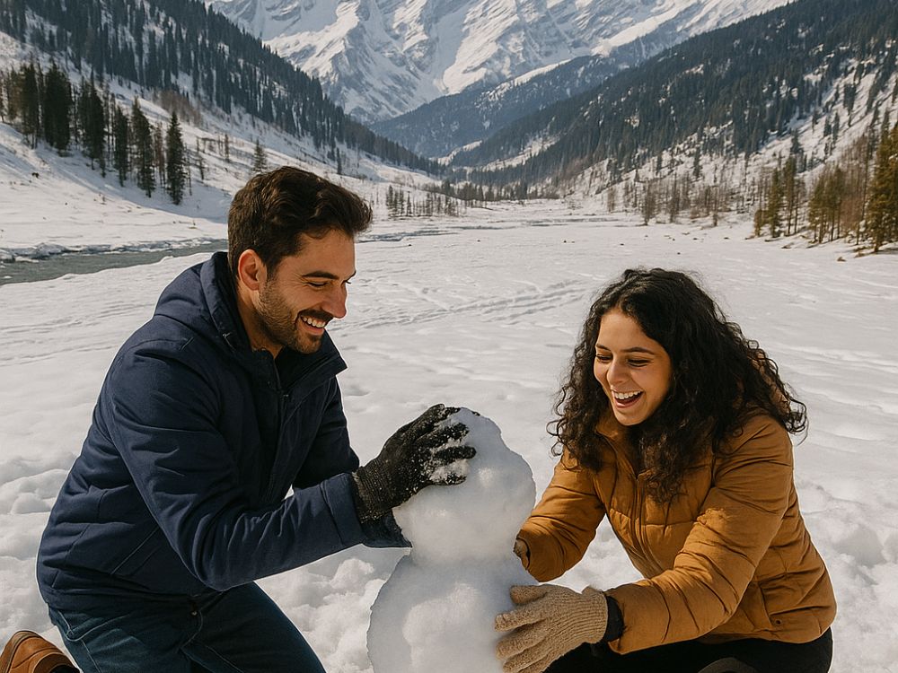 Couple carving snowman in Solang valley