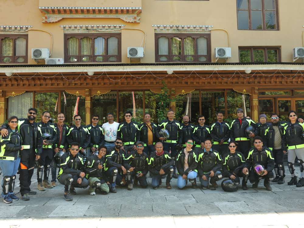 Enthusiastic bikers pose together during their road trip