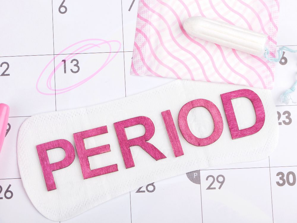Period on calendar with tampon & sanitary pad