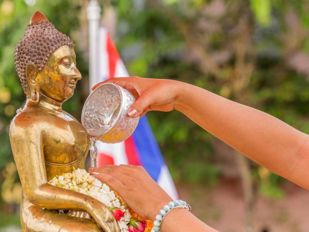 Buddha statue bathed with fragrant water