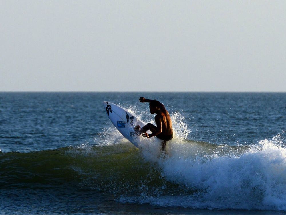 Surfing the waves, Mahabalipuram, Tamil Nadu