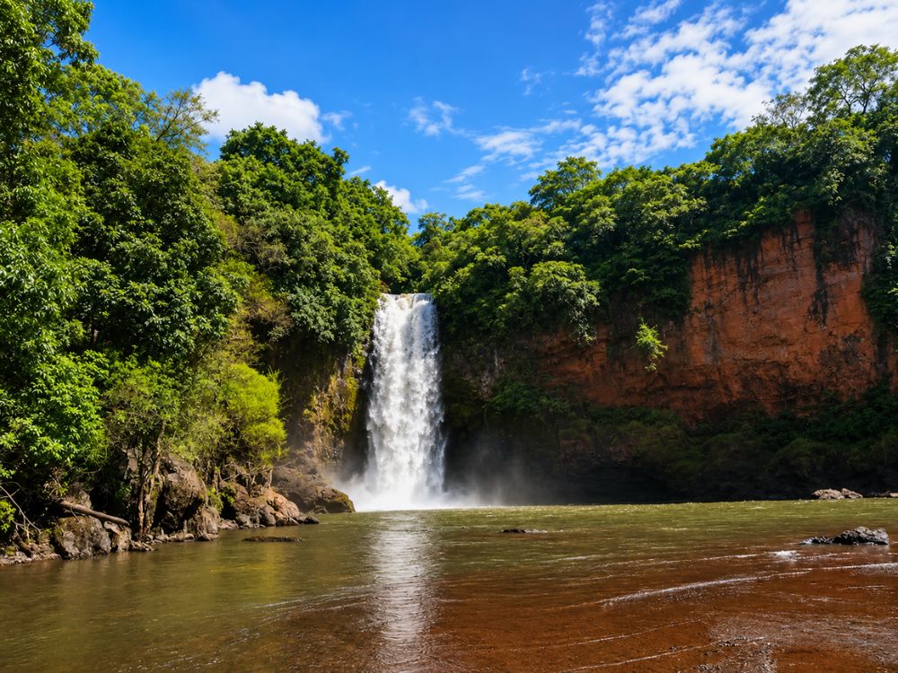Harvalem Waterfalls cascading through lush greenery in North Goa during the monsoon season.