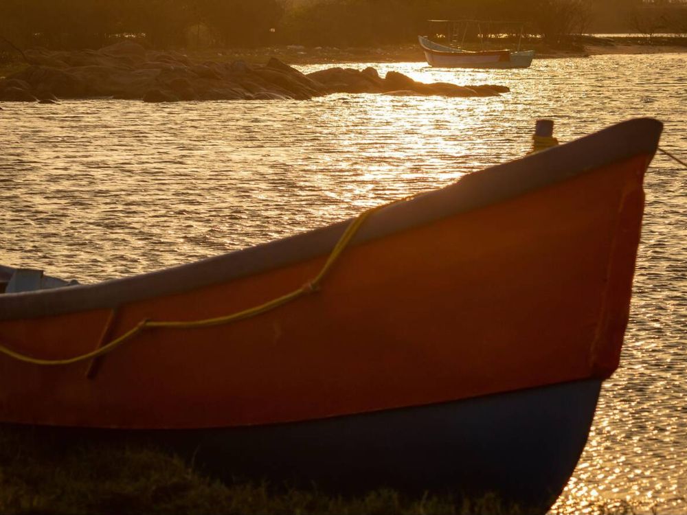 Fishermen boat along the backwaters during sunset near Covelong Beach