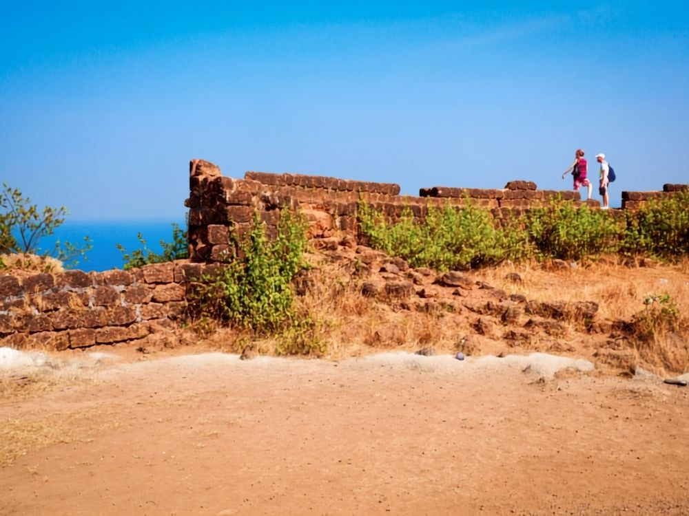 Visitors at Chapora Fort, a famous landmark in Goa.