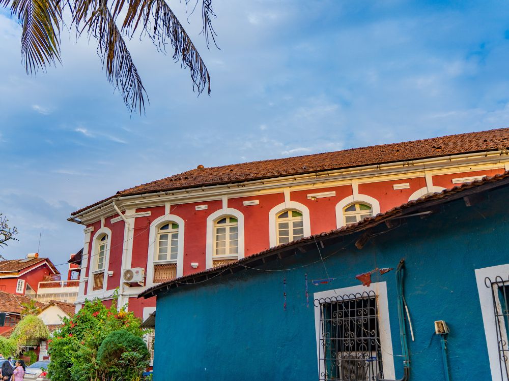 Blue-painted Portuguese-style houses lining a narrow street in Fontainhas, Goa's historic Latin Quarter.