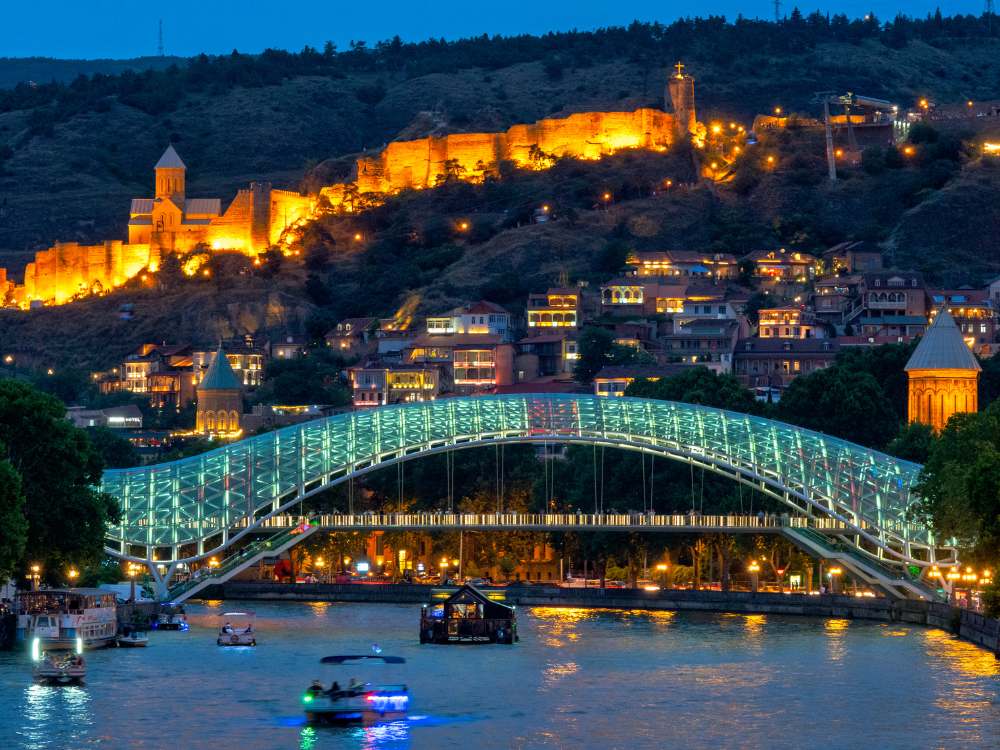 Illuminated Bridge of Peace spanning the Mtkvari (Kura) River in Tbilisi, Georgia